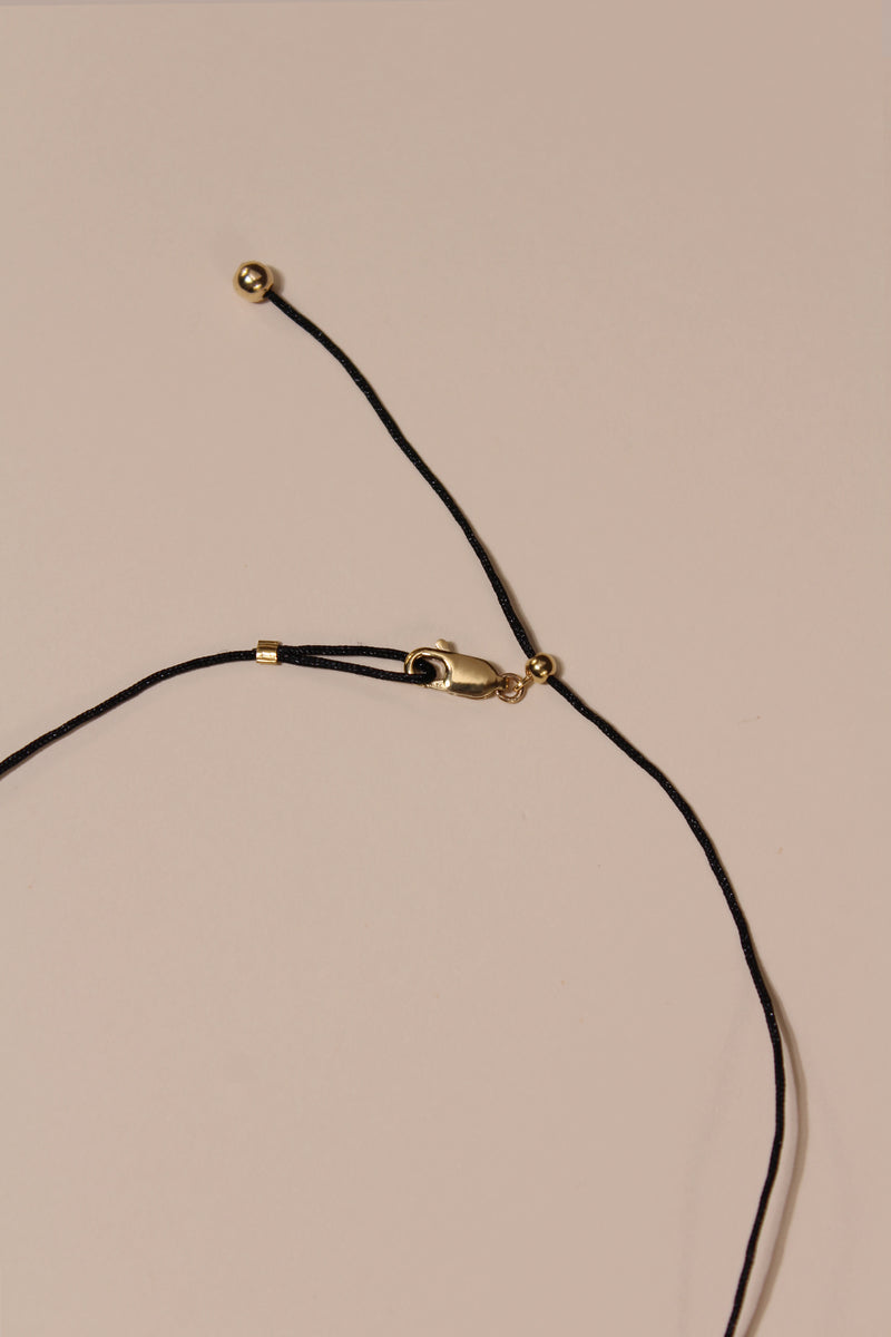 STRIKE A CORD TAG LETTER NECKLACE